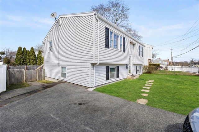 345 Post Rd, Warwick, RI 02888 - view of home's exterior featuring a yard and fence