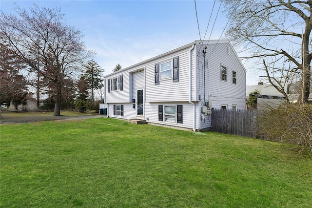 345 Post Rd, Warwick, RI 02888 - raised ranch with a front lawn and fence