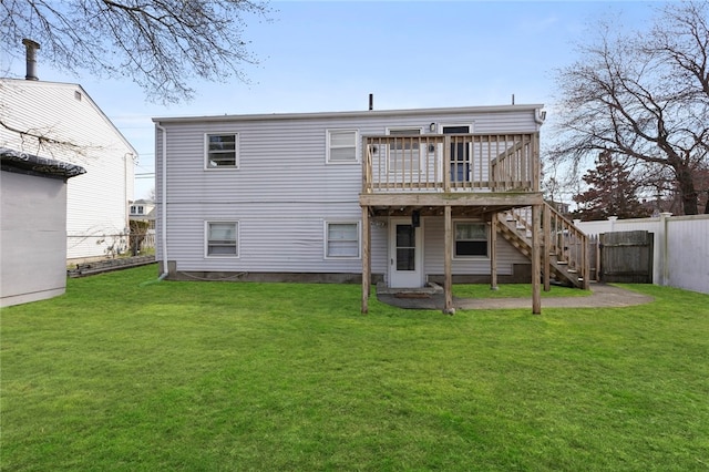 345 Post Rd, Warwick, RI 02888 - rear view of house featuring a yard, a fenced backyard, a wooden deck, and stairway