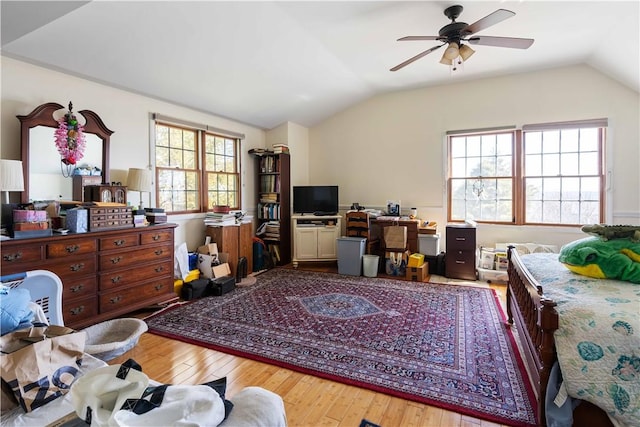 bedroom featuring hardwood / wood-style floors and lofted ceiling