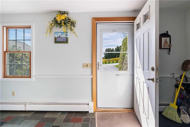 doorway to outside featuring a baseboard radiator