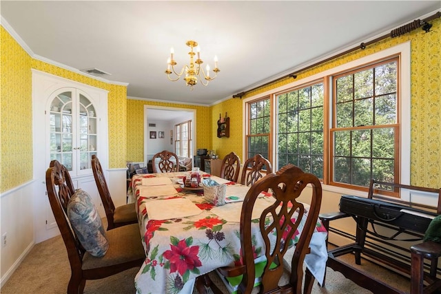 carpeted dining room featuring a notable chandelier, visible vents, wallpapered walls, and french doors