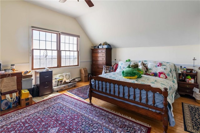 bedroom featuring wood finished floors, ceiling fan, and vaulted ceiling