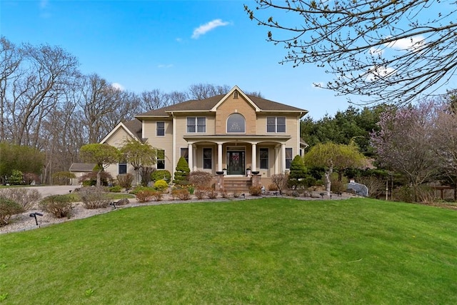174 Windmill Dr, South Kingstown, RI 02879 - view of front of house with covered porch and a front yard