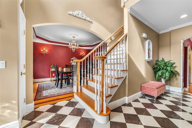 174 Windmill Dr, South Kingstown, RI 02879 - stairs with arched walkways, a chandelier, recessed lighting, baseboards, and ornamental molding