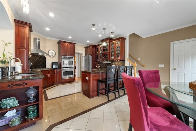 174 Windmill Dr, South Kingstown, RI 02879 - kitchen featuring wall chimney range hood, a sink, stainless steel appliances, light tile patterned floors, and backsplash