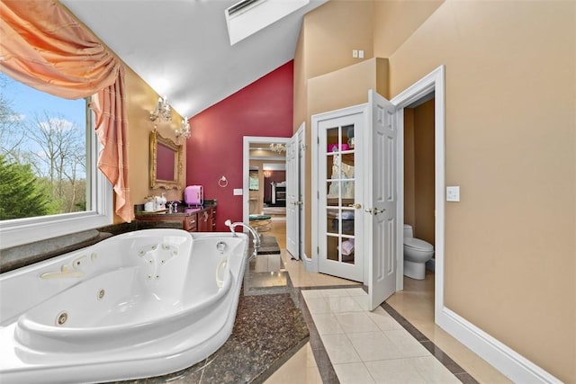 174 Windmill Dr, South Kingstown, RI 02879 - full bathroom with vanity, toilet, high vaulted ceiling, a whirlpool tub, and baseboards
