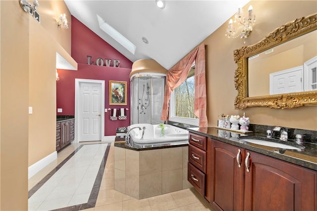174 Windmill Dr, South Kingstown, RI 02879 - full bathroom featuring a garden tub, vaulted ceiling, two vanities, a sink, and tile patterned floors