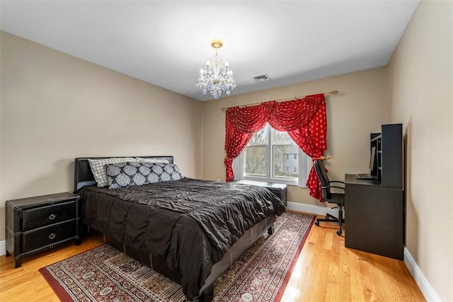 174 Windmill Dr, South Kingstown, RI 02879 - bedroom featuring baseboards, a chandelier, light wood-style flooring, and visible vents