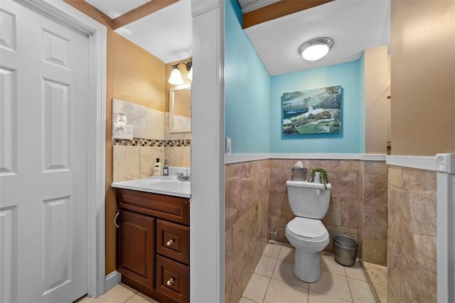 174 Windmill Dr, South Kingstown, RI 02879 - half bath with vanity, wainscoting, toilet, tile walls, and tile patterned floors
