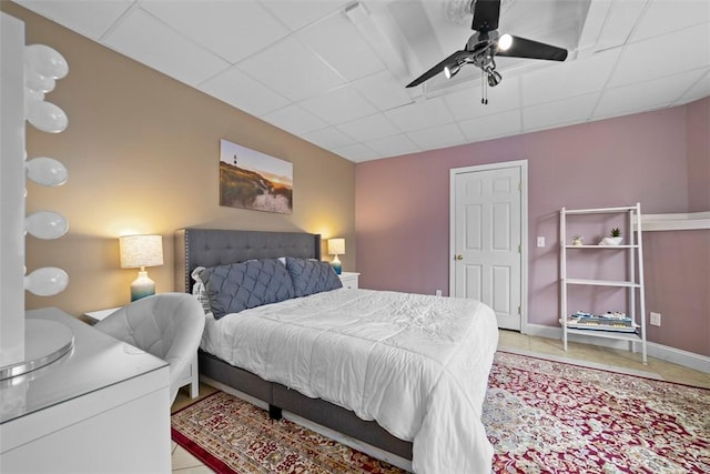 174 Windmill Dr, South Kingstown, RI 02879 - bedroom with tile patterned floors, a drop ceiling, and ceiling fan