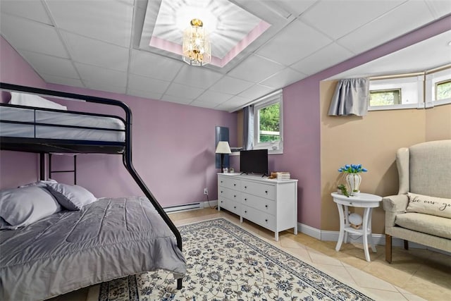 174 Windmill Dr, South Kingstown, RI 02879 - tiled bedroom with a paneled ceiling, baseboards, and baseboard heating