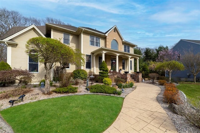 174 Windmill Dr, South Kingstown, RI 02879 - view of front of property featuring covered porch and a front yard