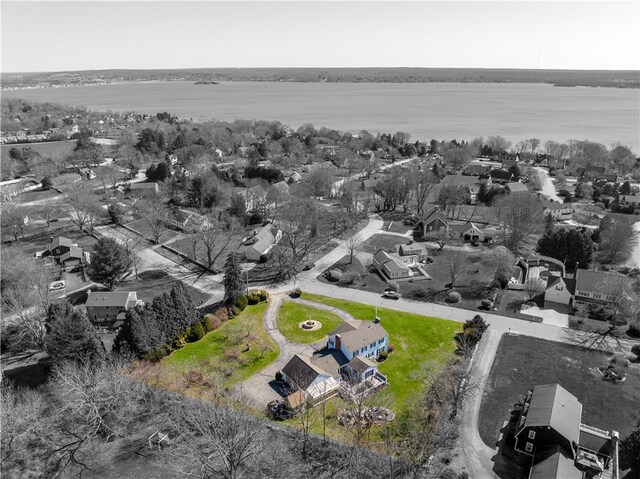 drone / aerial view with a residential view and a water view