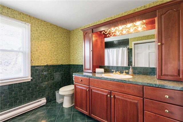 full bath featuring plenty of natural light, tile patterned flooring, wallpapered walls, and a baseboard radiator
