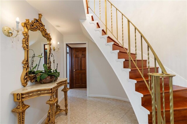 stairway featuring tile patterned floors