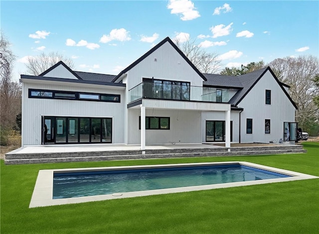 19 Castle Rd, Narragansett, RI 02882 - back of property featuring a yard, a patio area, an outdoor pool, and a balcony
