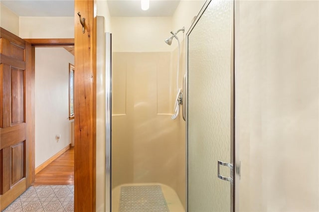 bathroom featuring a stall shower and tile patterned floors