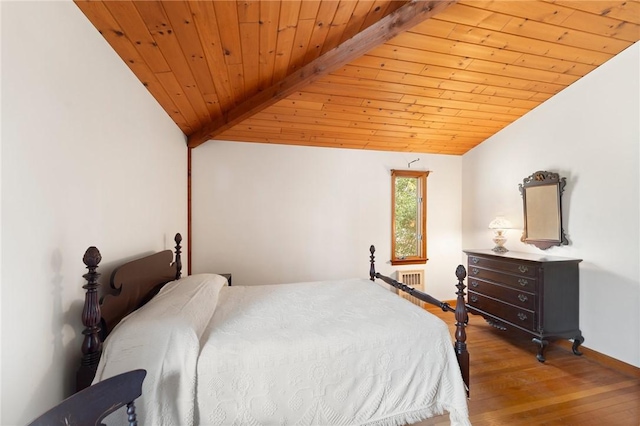 bedroom featuring lofted ceiling with beams, radiator heating unit, wooden ceiling, wood finished floors, and baseboards