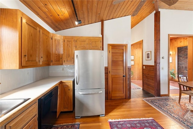 kitchen with freestanding refrigerator, light wood-style floors, lofted ceiling, dishwasher, and wood ceiling