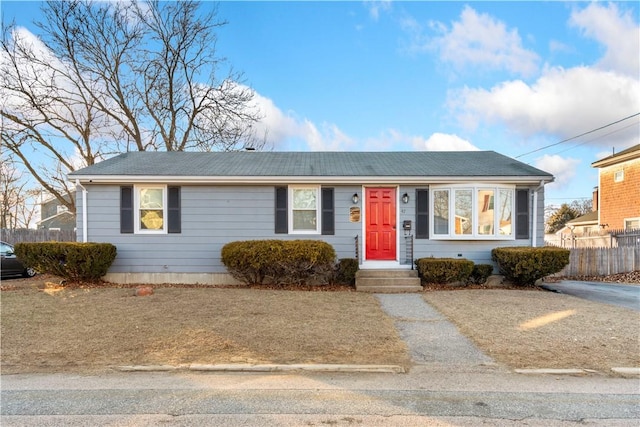 ranch-style house with fence