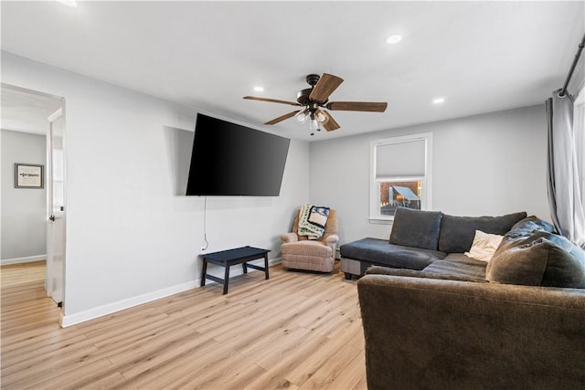 living room featuring light wood-style flooring, recessed lighting, baseboards, and a ceiling fan
