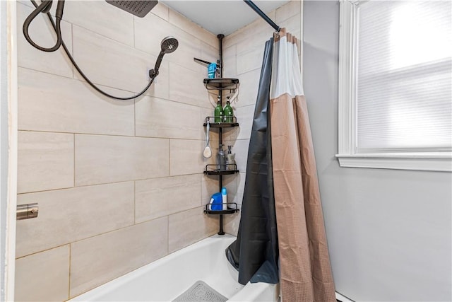 bathroom with shower / bathtub combination with curtain