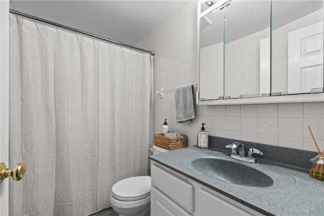 full bathroom with toilet, tasteful backsplash, vanity, and tile walls