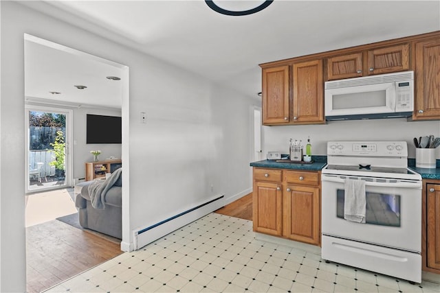 kitchen featuring baseboard heating, white appliances, dark countertops, brown cabinetry, and light floors