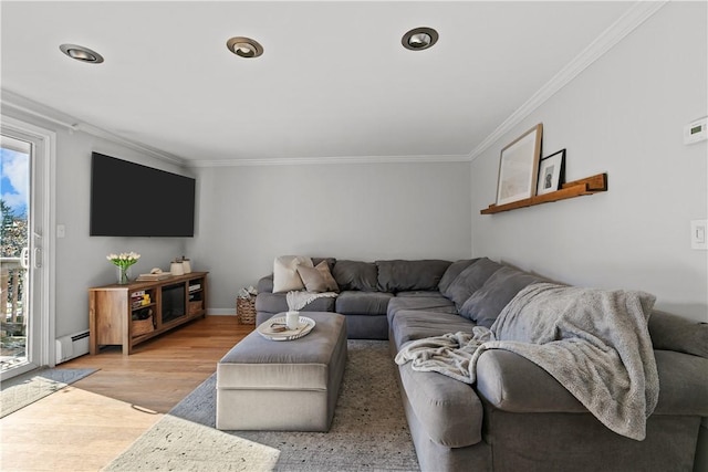living room with recessed lighting, light wood-style flooring, a baseboard heating unit, and ornamental molding