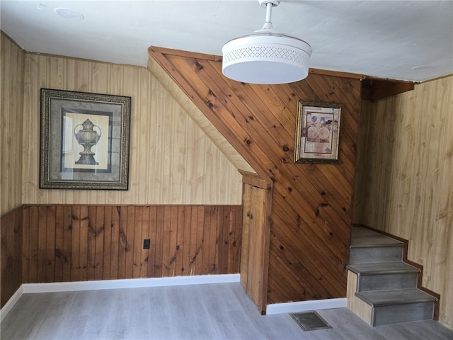 25 Wilson St, West Warwick, RI 02893 - stairway with visible vents, wood walls, wood finished floors, and baseboards