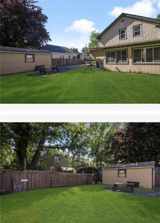 view of yard featuring an outbuilding, fence, and a storage unit