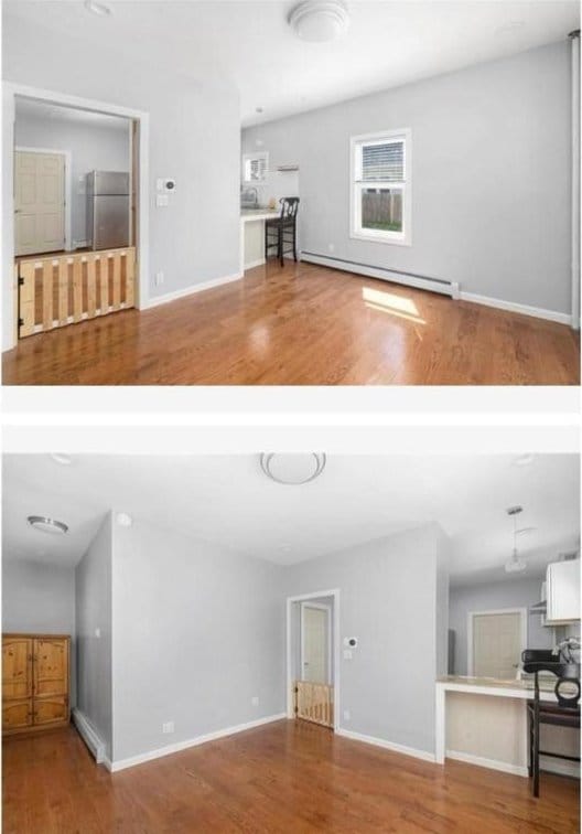 unfurnished living room with a baseboard radiator, wood finished floors, and baseboards