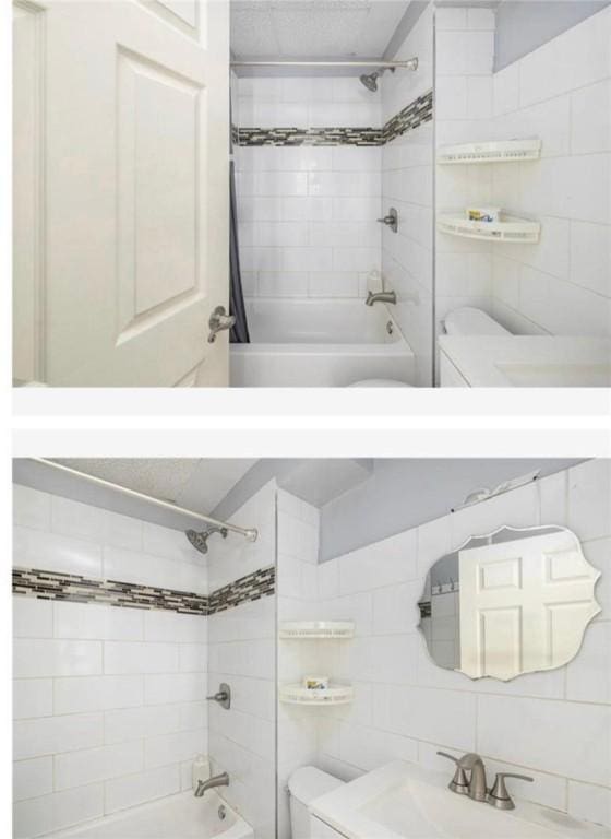 full bathroom featuring toilet, tile walls, a sink, and tub / shower combination