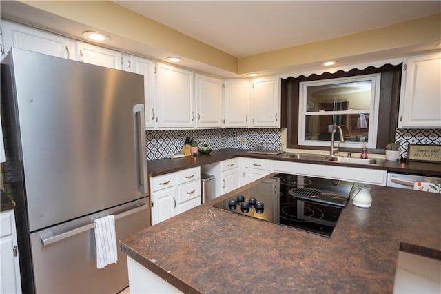 67 Highwood Dr, Coventry, RI 02816 - kitchen featuring a sink, freestanding refrigerator, black electric stovetop, and dark countertops