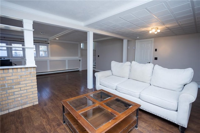 67 Highwood Dr, Coventry, RI 02816 - living area featuring dark wood finished floors, decorative columns, and a baseboard heating unit