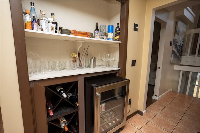 67 Highwood Dr, Coventry, RI 02816 - bar featuring light tile patterned floors, a dry bar, and beverage cooler