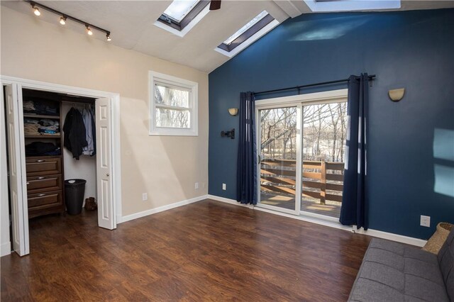 67 Highwood Dr, Coventry, RI 02816 - doorway to outside with baseboards, vaulted ceiling with skylight, and wood finished floors