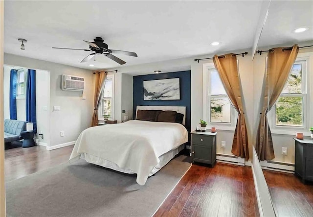 67 Highwood Dr, Coventry, RI 02816 - bedroom with dark wood-style flooring, a wall mounted AC, and recessed lighting