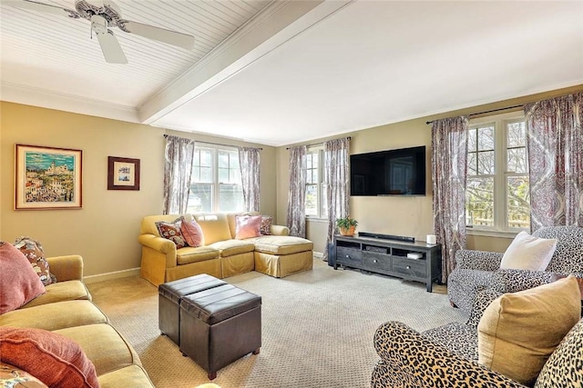 living room with carpet flooring, baseboards, beam ceiling, and ceiling fan