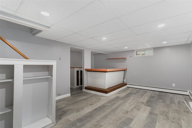 43 Eldorado St, Cranston, RI 02910 - bar featuring baseboards, a drop ceiling, wood finished floors, and baseboard heating