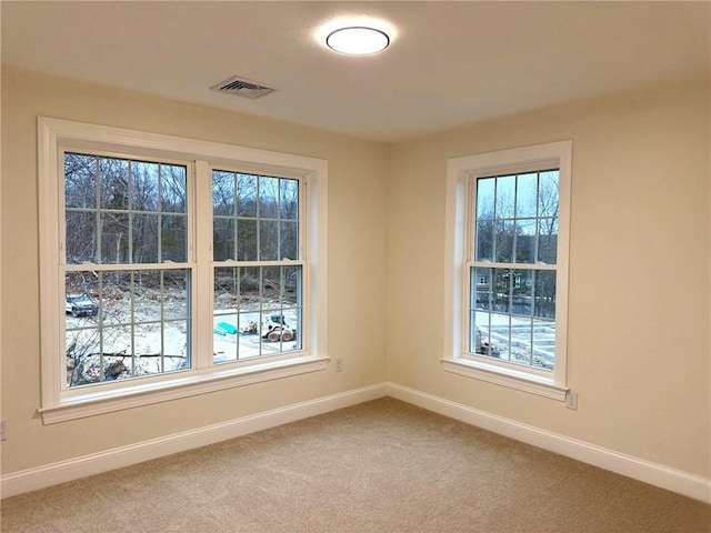 1404 Hunting Hill Dr, Cumberland, RI 02864 - carpeted empty room with a wealth of natural light, visible vents, and baseboards