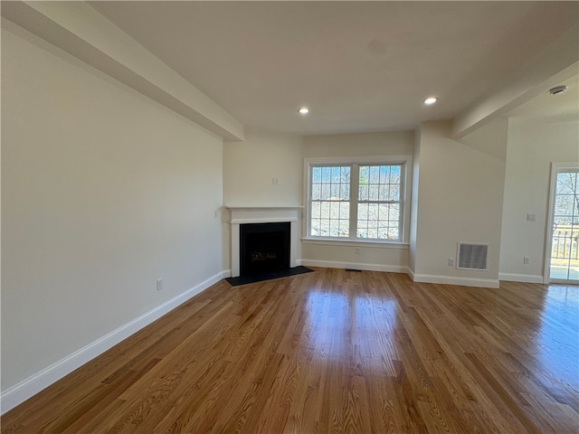 1404 Hunting Hill Dr, Cumberland, RI 02864 - unfurnished living room featuring a fireplace with flush hearth, recessed lighting, wood finished floors, visible vents, and baseboards