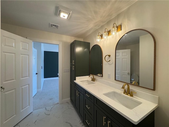 1404 Hunting Hill Dr, Cumberland, RI 02864 - full bathroom with double vanity, visible vents, marble finish floor, and a sink