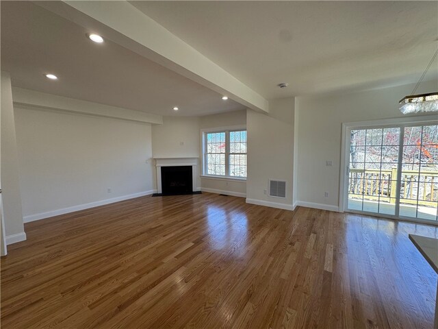 1404 Hunting Hill Dr, Cumberland, RI 02864 - unfurnished living room with recessed lighting, wood finished floors, visible vents, and baseboards