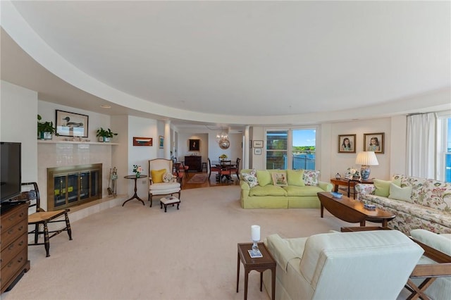 53 Conanicus Ave Unit 5A, Jamestown, RI 02835 - living area with carpet flooring, a tiled fireplace, and a wealth of natural light