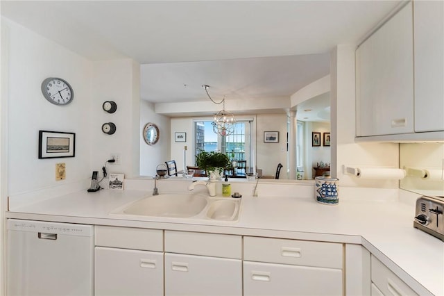 53 Conanicus Ave Unit 5A, Jamestown, RI 02835 - kitchen with a sink, light countertops, white cabinetry, and white dishwasher