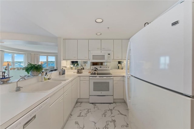 53 Conanicus Ave Unit 5A, Jamestown, RI 02835 - kitchen with a sink, white cabinets, white appliances, and marble finish floor