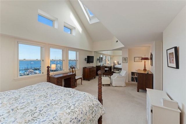 53 Conanicus Ave Unit 5A, Jamestown, RI 02835 - bedroom featuring a skylight, high vaulted ceiling, and light carpet