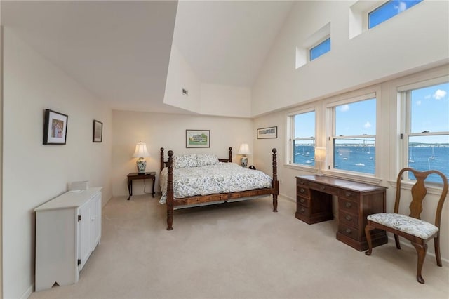 53 Conanicus Ave Unit 5A, Jamestown, RI 02835 - bedroom featuring multiple windows, light colored carpet, and baseboards
